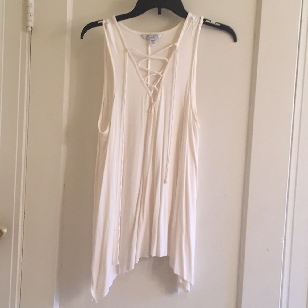 Cream sleeveless shirt